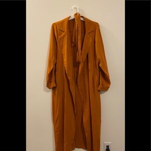 COPY - Burnt orange trench coat.